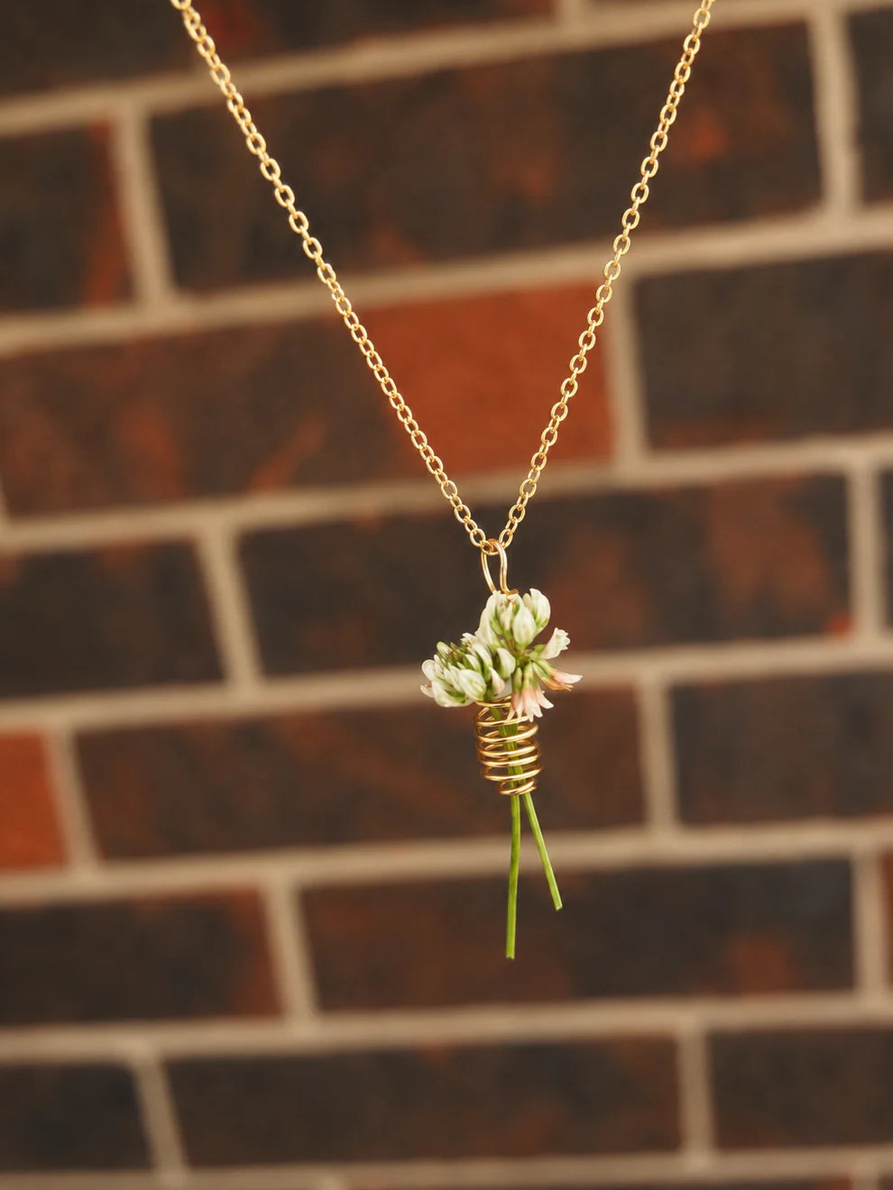 Flower keeper spiral necklace