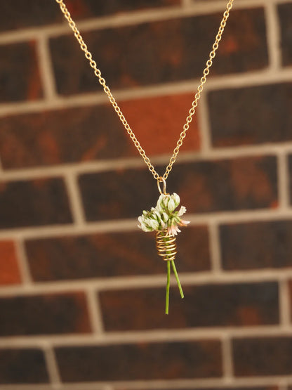 Flower keeper spiral necklace